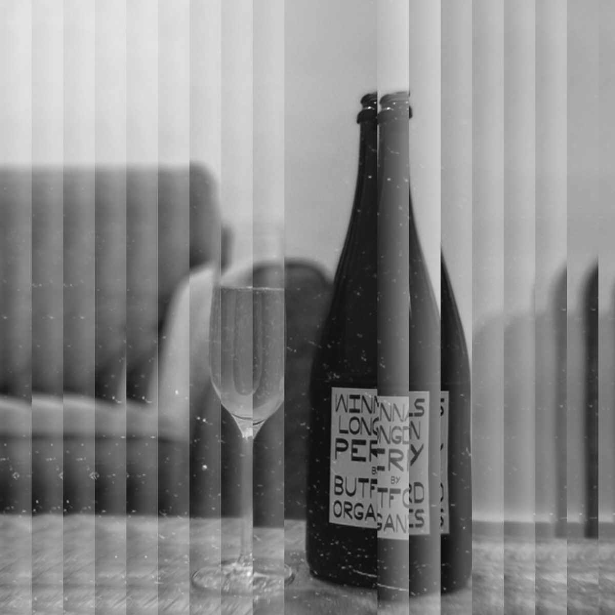 Image of a glass and a bottle of sparkling perry