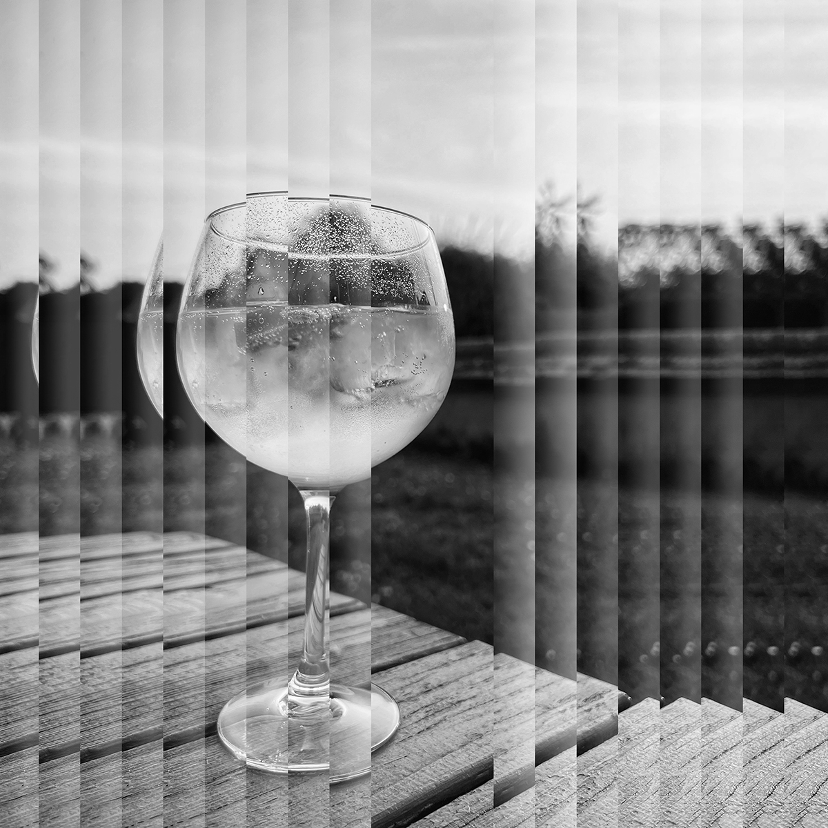 Image of a glass of gin and tonic on a table